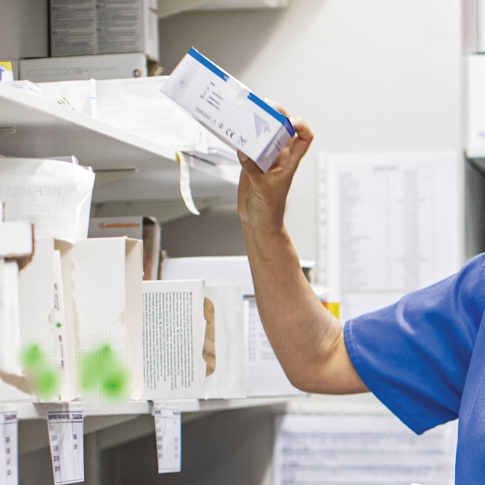 nurse in hospital stockroom 1200x1200